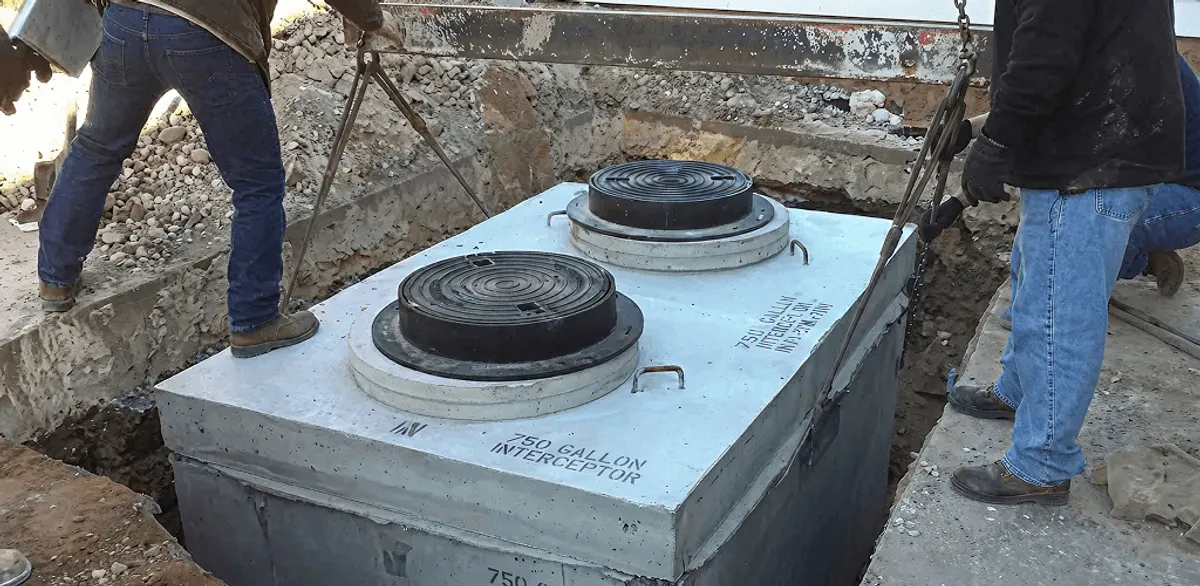 Grease trap installation for a commercial property drainage system in Huntsville, AL