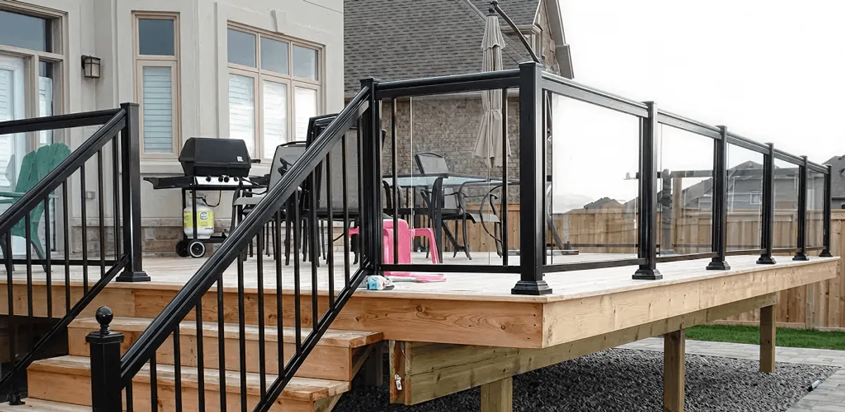 Handrail installation on a deck staircase for safety and code compliance in Huntsville, AL